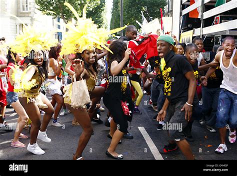 Notting Hill Carnival. Carnival entertainers dance during children's ...