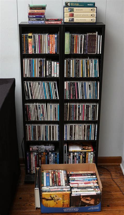 #244: A LARGE COLLECTION OF CDs, DVDs WITH SHELVES