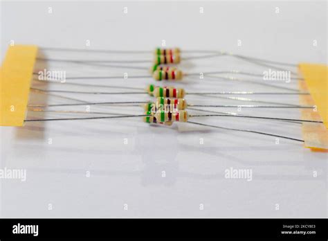 set of 10kilo ohm carbon resistors isolated against white background. Basic component of ...