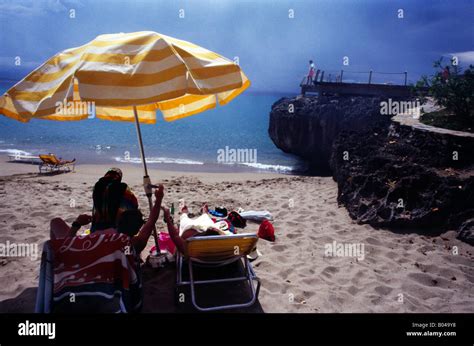 Playa Chiquita Dominican Republic People Under Beach Umbrella Stock