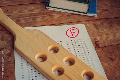 Wooden Paddle For Spanking And Bad Report From School Corporal