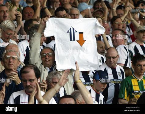 West Bromwich Albion Fans Hold A T Shirt Celebrating Their Promotion To