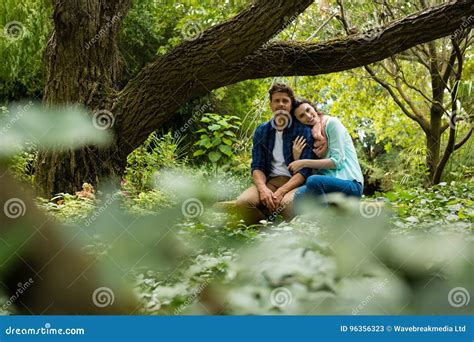 Romantic Couple Sitting On Bench In Garden Stock Image Image Of Love