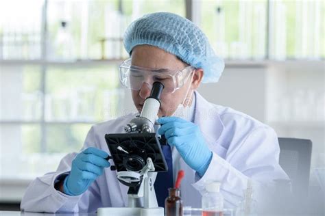 Asian Man Scientist Researching And Learning In A Laboratory Stock