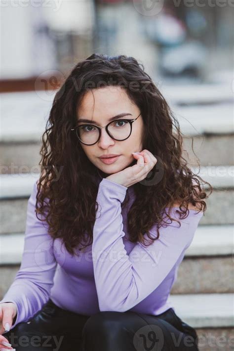 Beautiful Young Woman With Brunette Curly Hair Portrait In Eye Glasses