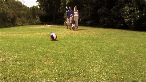 Family in park playing football Stock Video Footage - Storyblocks