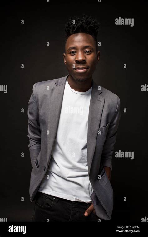 Close Up Portrait Of Handsome Black Man With Charming Smile Studio