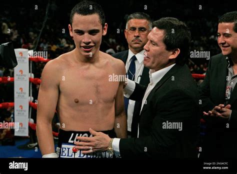 Julio Cesar Chavez Sr Right Congratulates His Son Julio Jr After His Son Defeated Grover