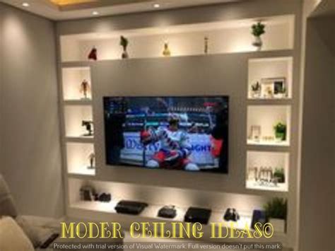 a flat screen tv mounted on a wall in a living room with built - in ...