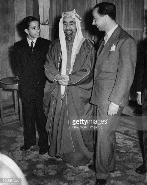 In Ceremonial Uniform King Faisal Ii Of Iraq Sitting On A Throne At