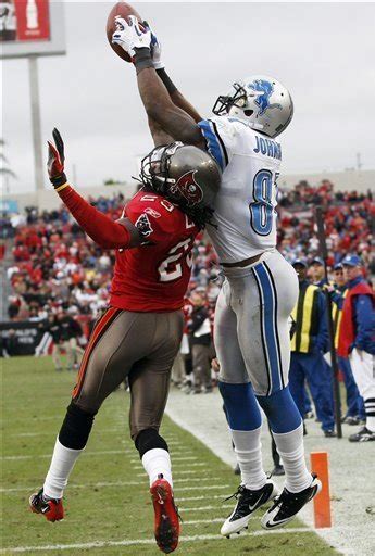 Detroit Lions Receiver Calvin Johnson And Defensive Tackle Ndamukong