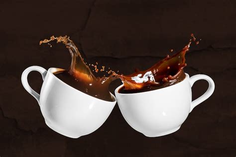 Premium Photo | Coffee cheers with splash effect on brown stony background