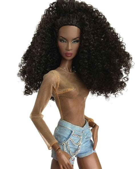 A Barbie Doll With Very Long Hair And No Shirt On Posing For The Camera