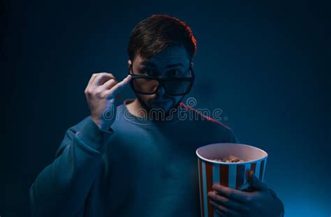 Man With Surprised Expression And Popcorn Emotion While Watching A