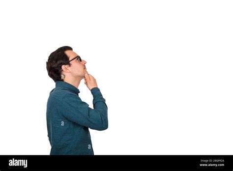 Side View Of Young Businessman Keeps Hand Under Chin Thoughtful