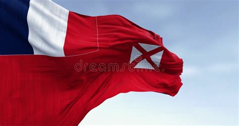 National Flag Of Wallis And Futuna Waving On A Clear Day Stock