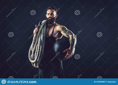 Muscular Man Working Out With Heavy Rope Photo Of Man With Naked Torso