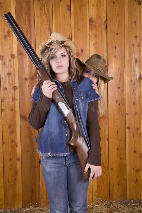 Girl With Shotgun Another Girl Behind Stock Image Image Of Bale