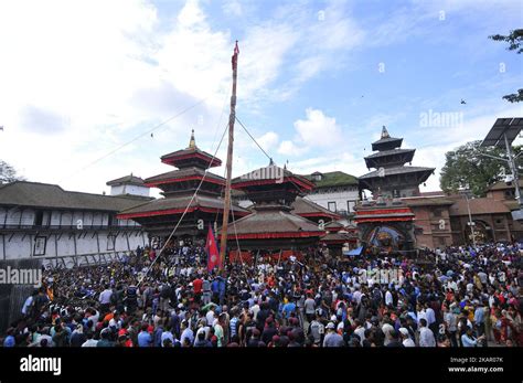 Nepalese Devotees Pulling Rope To Erecting The Long Wooden Log Yo