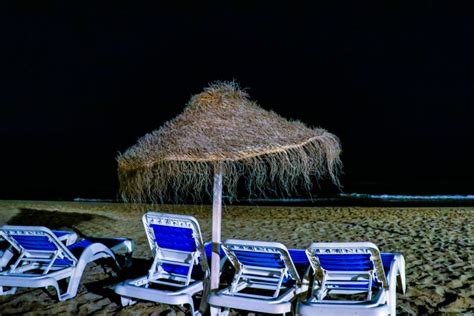 Beach by Night Illuminated by City Lighting Stock Image - Image of palm ...