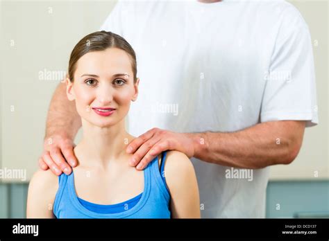 Female Patient At The Physiotherapy Doing Physical Exercises With Her