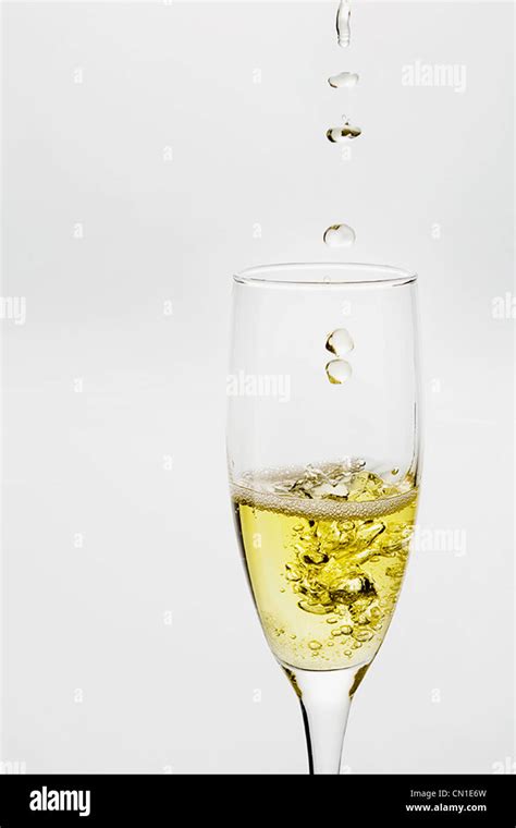 Champagne Dropping Into Glass Stock Photo Alamy