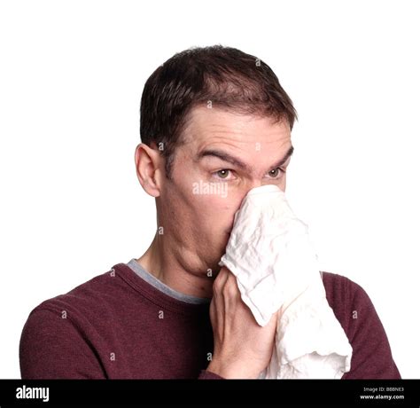 Man Blowing His Nose Into A Handkerchief Stock Photo Alamy