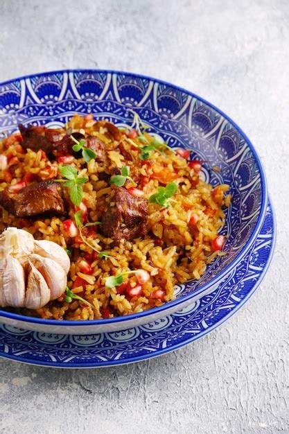 Premium Photo | Pilaf and ingredients on plate. national uzbek pilaf ...