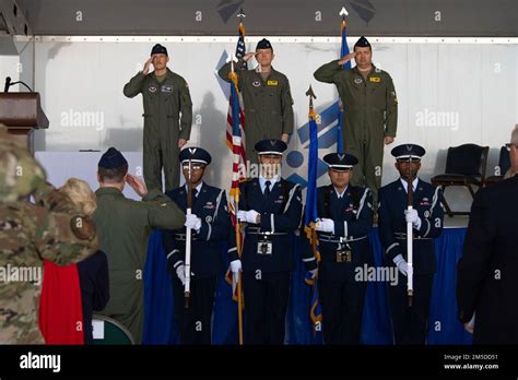 U S Air Force Airmen Salute The American Flag During The National