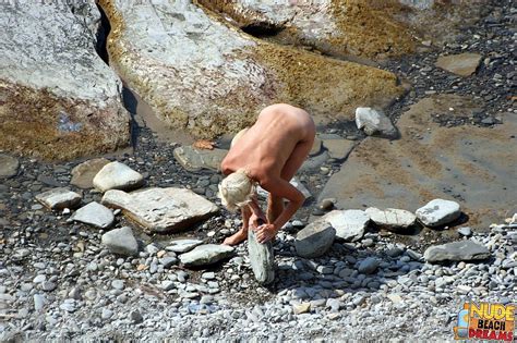 Naked Milf Playing With Her Man On The Beach Photos