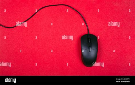 Computer Black Mouse On Red Background Top View Stock Photo Alamy