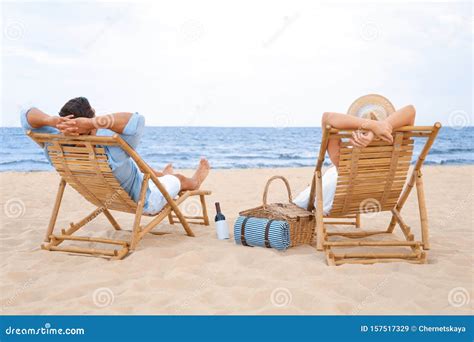 Happy Young Couple Sitting On Deck Chairs Stock Image Image Of Exotic