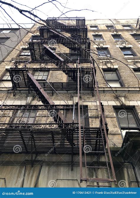 Typical New York Apartment Building with Steel Fire Escape Ladders