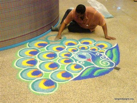 Peacock Rangoli Design | Rangoli designs, Indian folk art, Rangoli ...