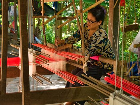 A Female Weaver Producing Silk Fabric on a Traditional Hand Loom on ...