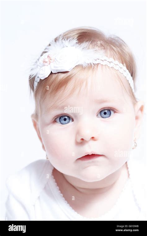 Little baby girl with gorgeous blue eyes isolated on white background ...