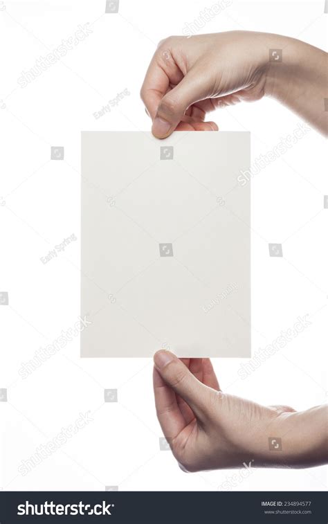 A Femalewoman Hand Holdpick Up A Emptyblank Paperpost Card