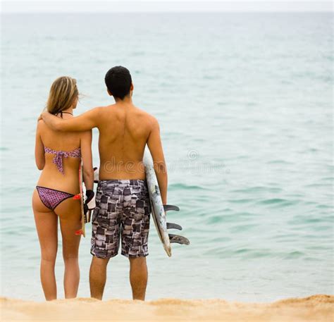 Young Surfers Couple On The Beach Stock Image Image Of Smiling