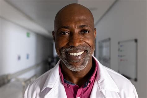 Premium Photo Portrait Of Happy African American Male Doctor Wearing