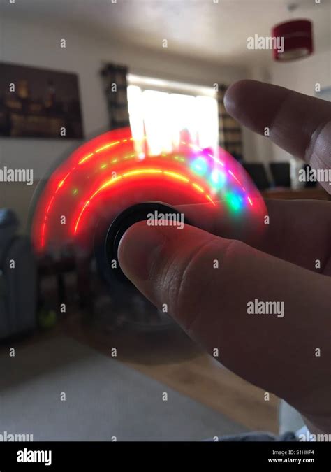 Fidget spinner lighting up Stock Photo - Alamy