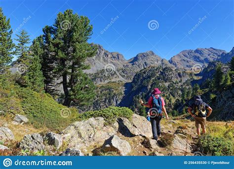 Couple Of Hikers On The Mountain Path Gr738 Between Chamrousse And The