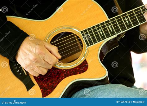 Man strumming guitar stock photo. Image of guitar, wood - 16367548