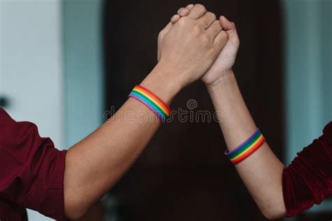 The Lgbt Couple Or Lgbtqia Couple Wear Rainbow Colored Wristbands On