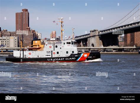 Coast Guard Patrol Boat On East River Approaching The Manhattan Bridge