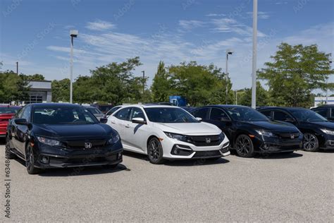 Honda Civic display at a dealership. Honda offers the Civic in sedan ...