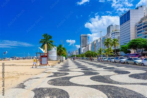 View Of Leme Beach And Copacabana With Palms And Mosaic Of Sidewalk In