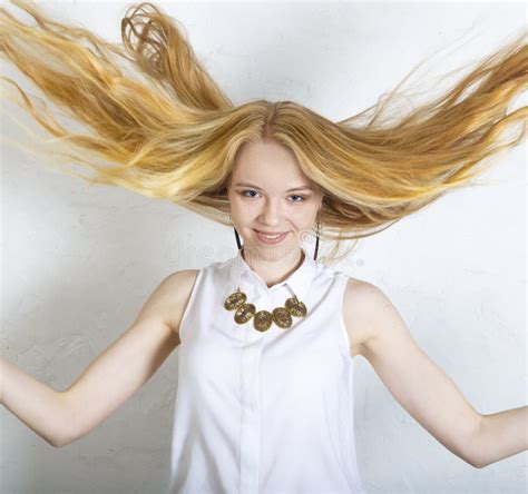 Fashion Portrait Of Beautiful Blonde Girl With The Flying Hair Stock