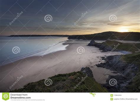 Three Cliffs Bay and the Great Tor Stock Photo - Image of scenery, blue ...