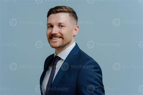 Sideways Shot Of Smiling Corporate Worker Dressed In Formal Outfit