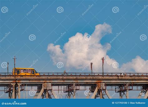 Yellow Bus Rides On The Bridge School Bus On The Sky Background Stock